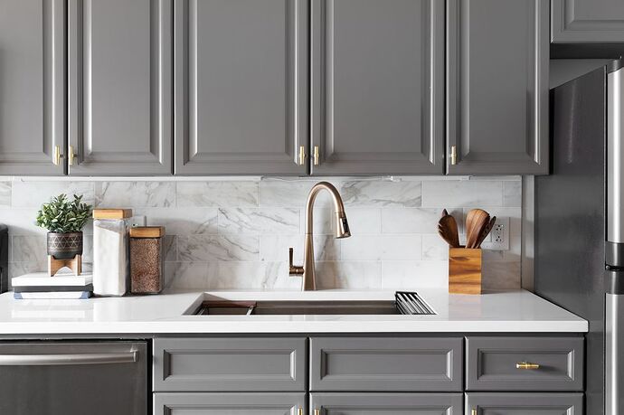 gold-kitchen-faucet-detail-with-grey-cabinets-royalty-free-image-1744733952.pjpeg